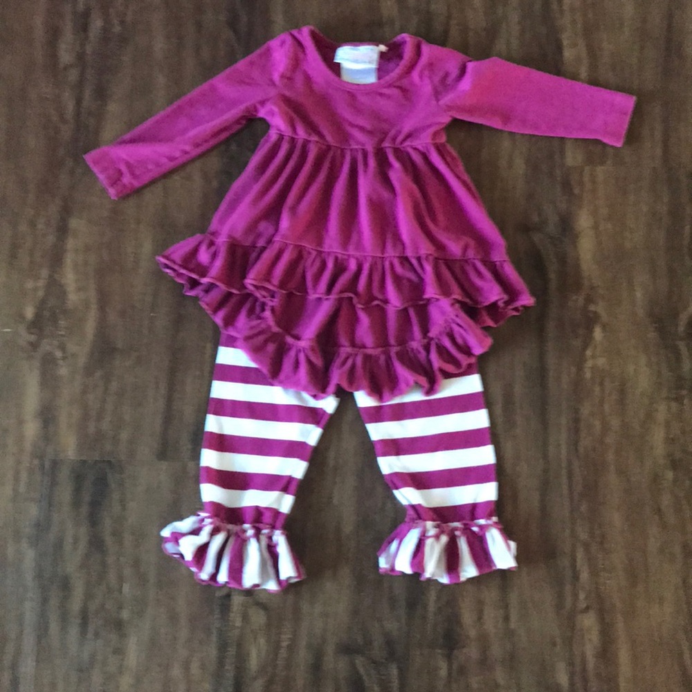 Ruffle top with striped matching bottoms.